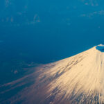 Beautiful Fuji Mountain viewed from airplane in early winter sea