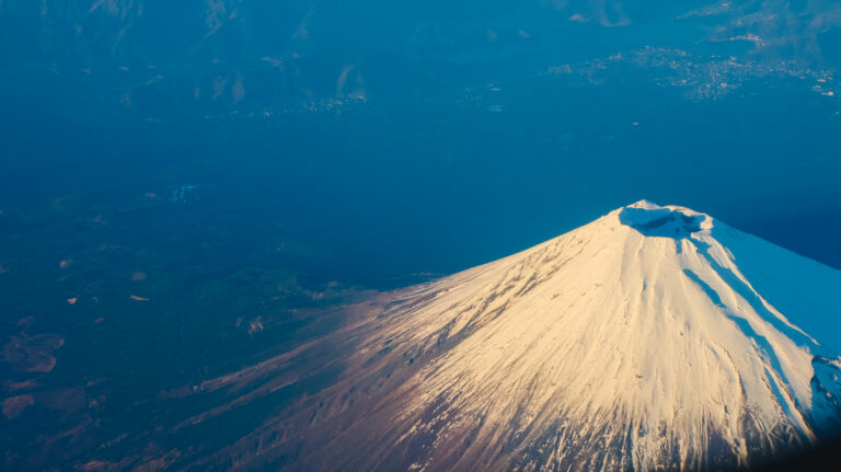 Beautiful Fuji Mountain viewed from airplane in early winter sea